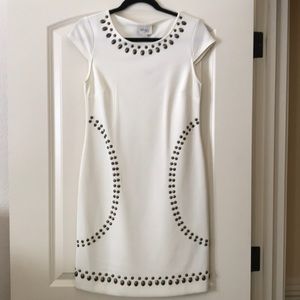 Ivory dress with bronze embellishments